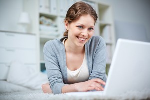 Pretty girl networking on laptop, New Benefits for Accounting Website Clients and Copyright Date